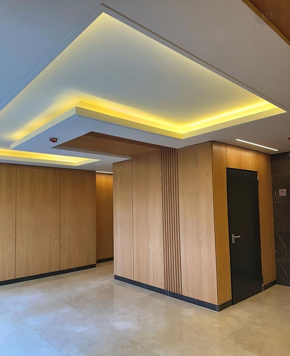 Oak cladding under a lit ceiling cove