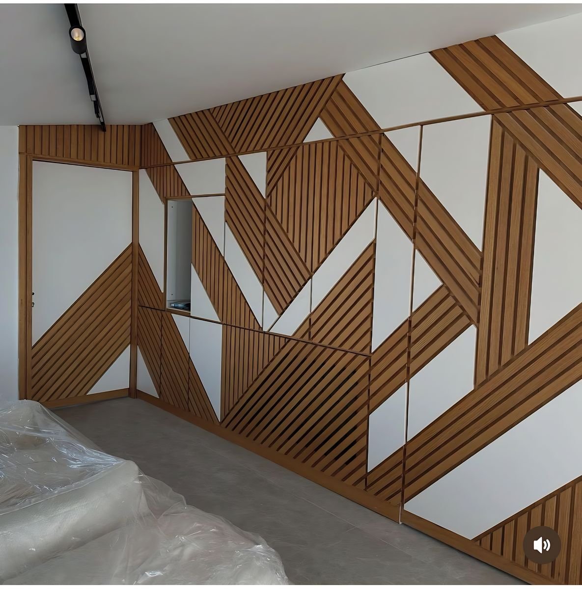 Diagonal oak slats on a white wall