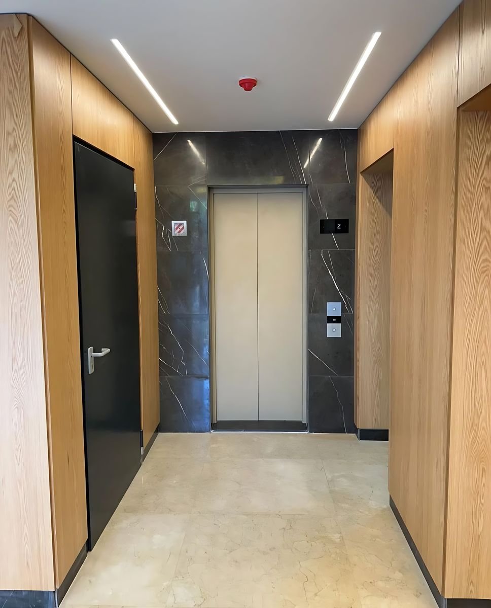 Oak-clad lift lobby