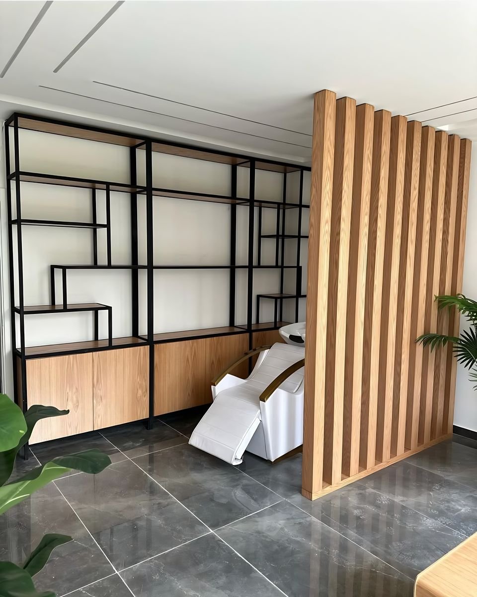 Oak slats and black steel shelving in a salon