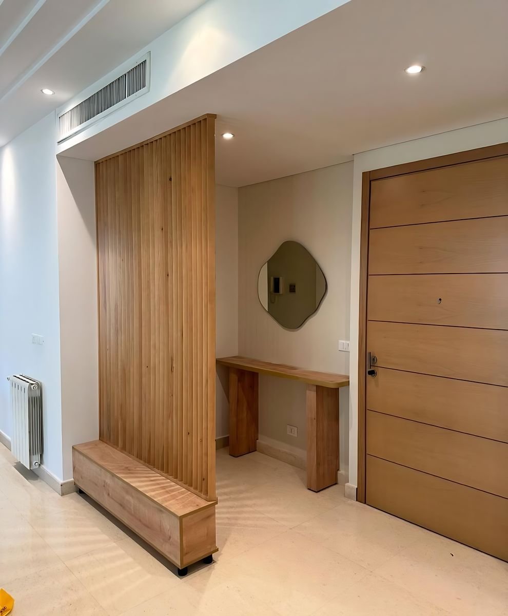 Oak slat screen at an apartment entrance