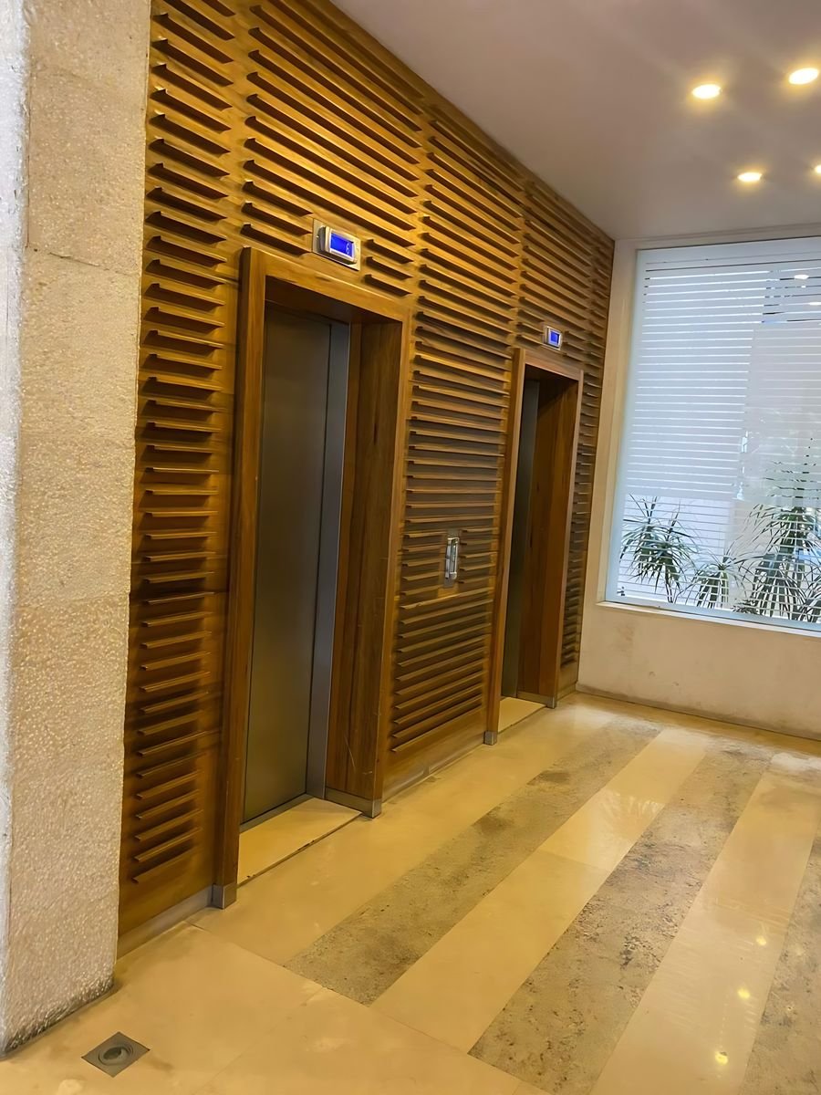 Slatted walnut lift lobby