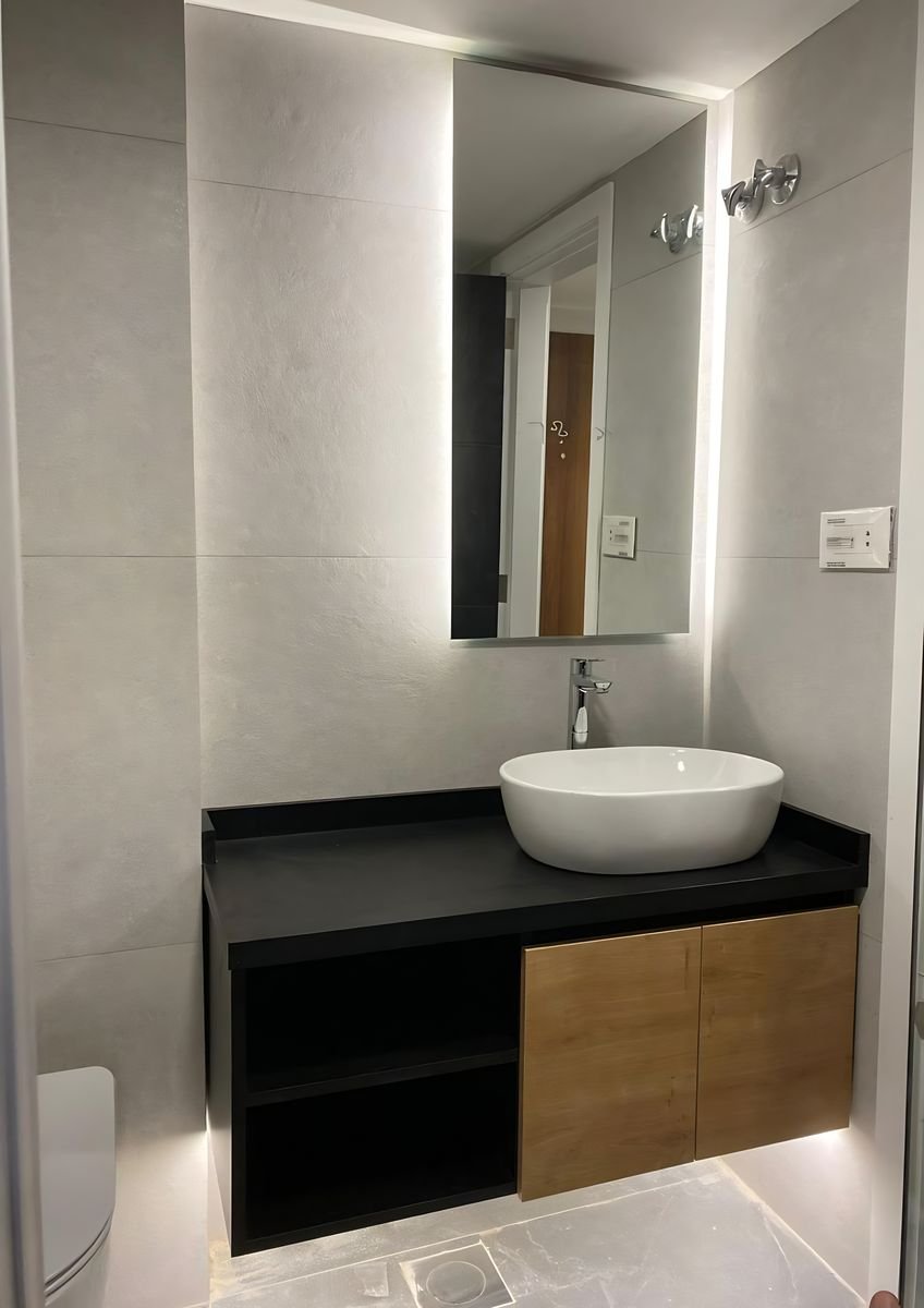 Black vanity with an oak drawer