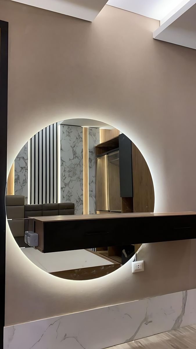 Floating vanity with a backlit round mirror